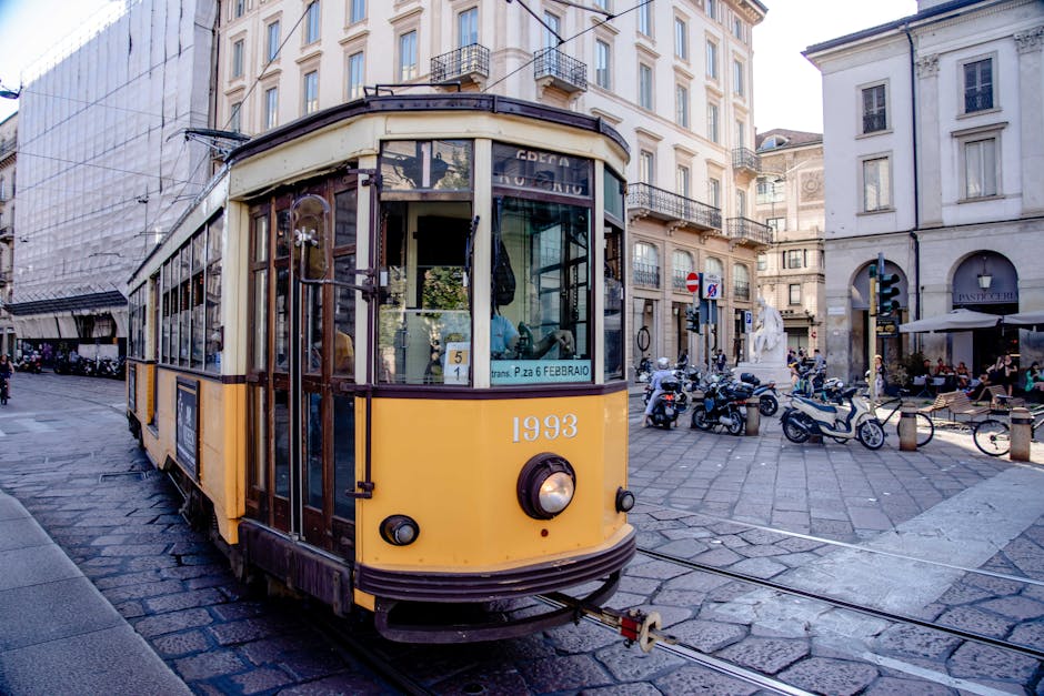 Classic yellow tram in a busy European c