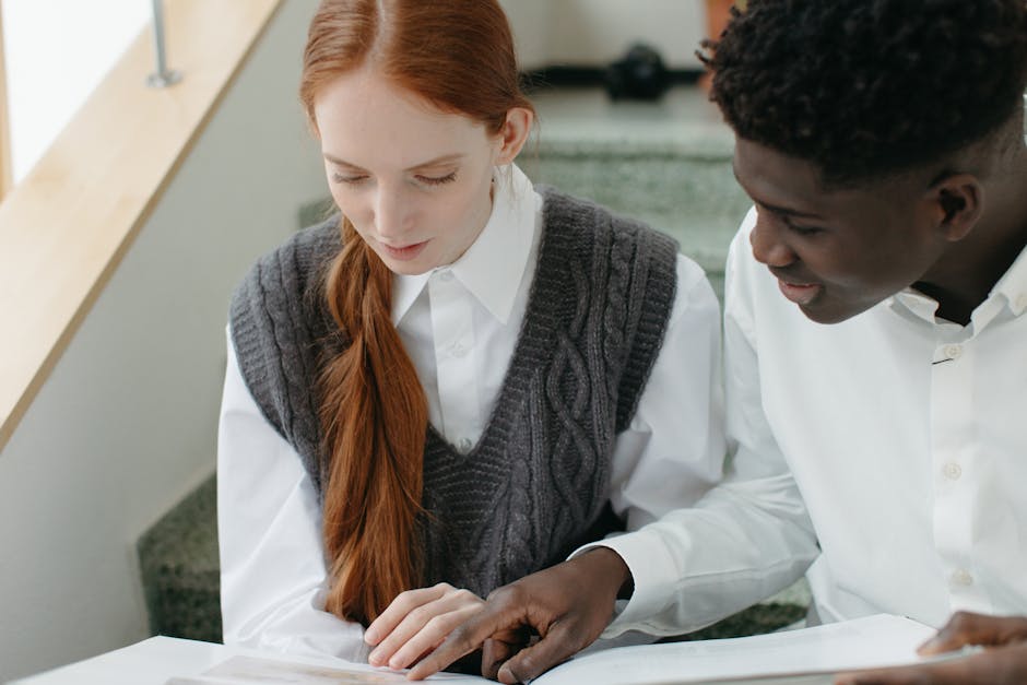 Young couple studying together indoors,