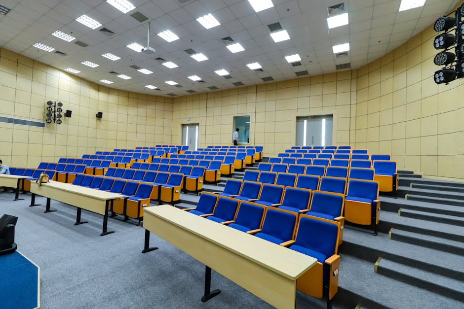 Spacious lecture hall with blue seats an