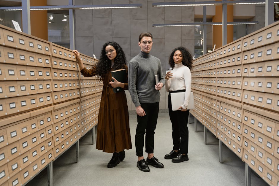 Three diverse students researching in a