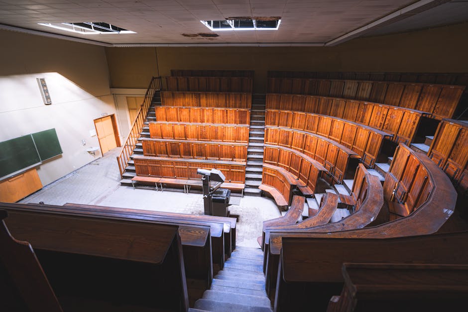Empty vintage lecture hall with wooden s